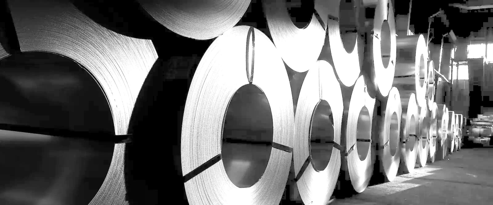 Rolled aluminium coil stock in a mill warehouse