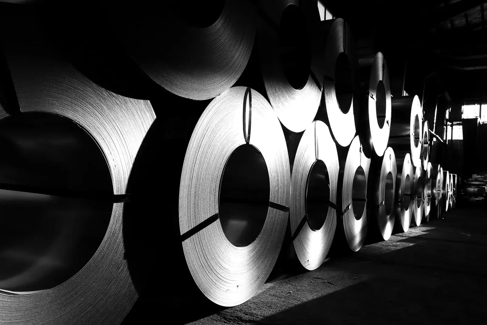 Rolled aluminium coil stock held in a mill warehouse
